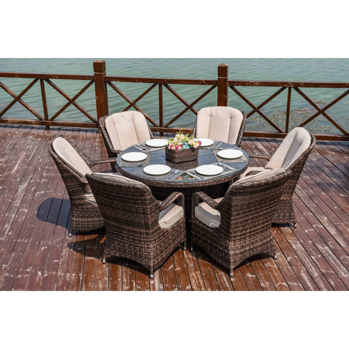 Juego de comedor redondo de 7 piezas de mimbre y ratán para exteriores con cojines de Moda Furnishings
